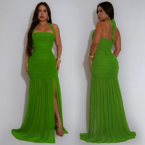 Detail of bright green ruched halter maxi dress with high slit and sheer fishtail hem
