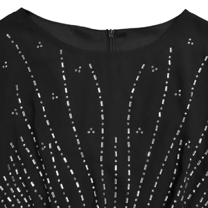 Detail of elegant black dress with shimmering rhinestones and invisible back zipper closure