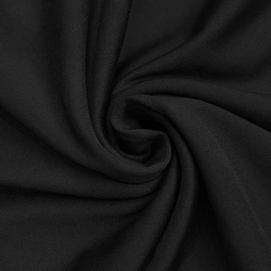 Vue macro d'un tissu en maille élastique noir de qualité avec une texture soyeuse et fine