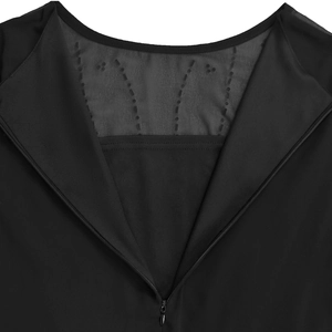 Close-up of elegant black dress back with mesh patchwork and invisible zipper detail