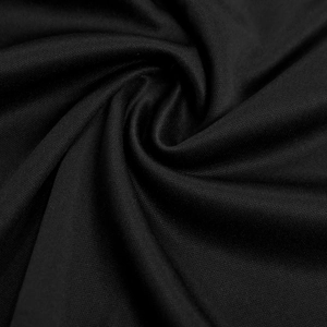 Close-up macro of black stretch knit fabric texture with soft drape and spiral folds