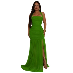 Detail of bright green halter neck maxi dress with side slit and pleated shimmery fabric