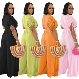 Detail of drawstring sleeves and wide leg cut on linen blend jumpsuits in four colors