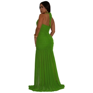 Detail of lime green maxi dress showing delicate mesh pleats and backless halter neck