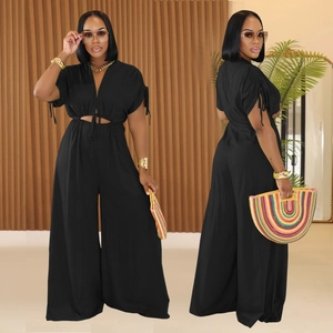 Women's chic black V-neck wide-leg jumpsuit with waist cut-out and drawstring tie