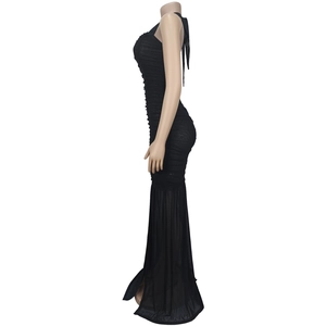 Detail of ruched black sleeveless dress with elegant sheer mesh fishtail hemline