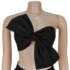 Detail of black strapless bandeau top with large oversized decorative bow design