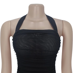 Detail of black mesh halter neck top with ruched fabric texture on a mannequin