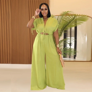 Lime green V-neck jumpsuit with waist drawstring and wide legs on a female model