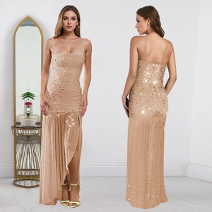Close-up of champagne gold sequined dress with high slit and elegant side drape detail