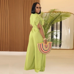 Detail of the drawstring ruched sleeve and lime green fabric on this wide leg jumpsuit