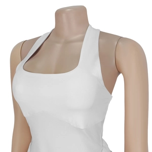 Close-up of white backless jumpsuit with wide square neckline and elastic yoga fabric