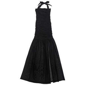 Detail view of the black mesh halter dress featuring ruched texture and a side slit