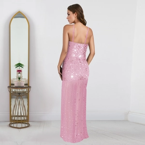 Detail view of pink rhinestone evening dress featuring a low back and slender straps