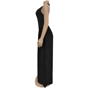 Detail of a black halter neck jumpsuit featuring a backless design and fluid drape