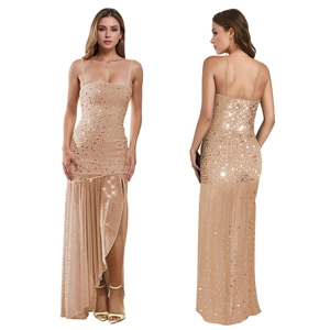 Detail of champagne sequin gown showing side slit and adjustable thin straps on a model