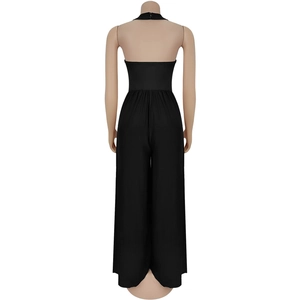 Detail of black backless halter jumpsuit with elastic waist and wide-leg trousers
