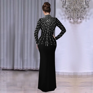 Elegant black long sleeve evening gown with radiant pearl and rhinestone beadwork decor