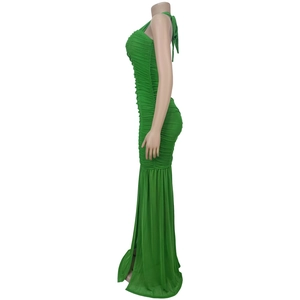 Detail view of the grass green ruched mesh evening dress with fishtail hem and slim fit design