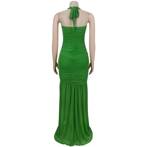 Close-up back view of green ruched maxi dress with halter neck and open back detail