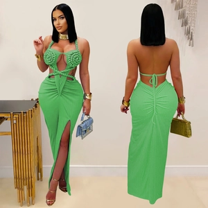 Green halter neck maxi dress with cutout waist, twist knot detail and high side slit