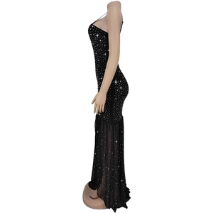Detail view of the black evening dress showing rhinestones and sheer mesh fishtail hem