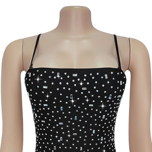 Detail of black rhinestone camisole dress with sparkling silver crystal embellishments