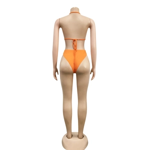 Rear view of bright orange string bikini set with high-waist bottoms on white background