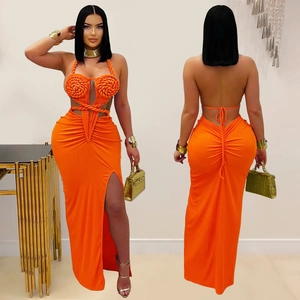 Detail of orange halter dress with handmade woven spiral chest and side cutout
