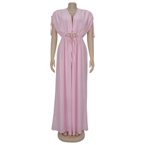 Detail view of pink deep V-neck wide leg jumpsuit with waist cut-out and drawstring ties
