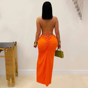Detailed back view of orange halter maxi dress featuring ruched drawstring and ribbed fabric
