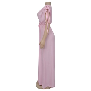 Detailed side view of pink V-neck wide leg jumpsuit with waist tie and drawstring cuffs