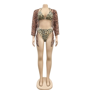 Three-piece leopard print bikini set including halter top, high waist bottoms and mesh cover-up