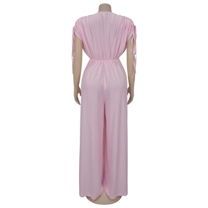 Detail view of pink wide-leg jumpsuit with adjustable shoulder drawstrings and elastic waist