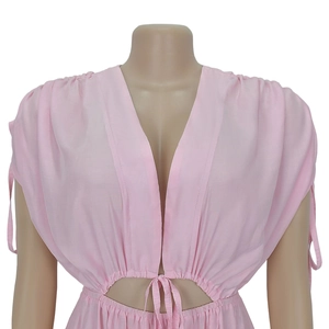 Detail of light pink V-neck top with waist cut-outs and delicate center tie string