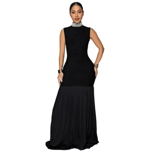 Detail of beaded neckline and pleated mermaid hem on elegant black sleeveless dress