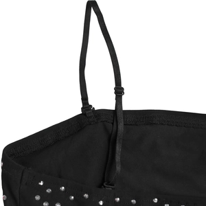 Close-up of adjustable straps and silver rhinestones on black evening slit dress