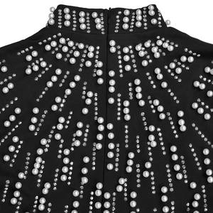 Detail of black dress with beaded white pearls and invisible back zipper closure