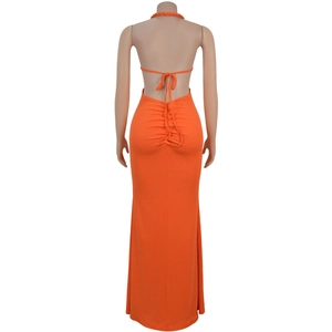 Detail view of bright orange halter backless dress with ruched drawstring design