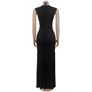 Rear view of black sleeveless bodycon dress with pearl collar and pleated hem detail