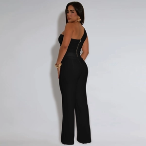Detail of slim-fit black one-shoulder jumpsuit with metal zipper on the back