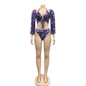 Detailed front view of three-piece purple peacock print bikini set with long sleeve cover-up