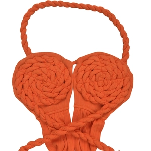 Detailed close-up of vibrant orange knit halter top featuring 3D floral textures