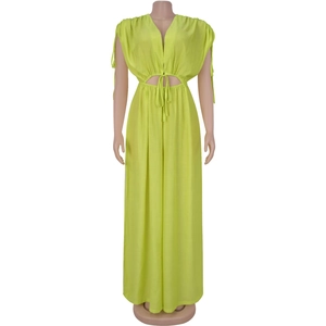Detail of lime green maxi dress with deep V-neck, waist cut-outs and drawstring ties