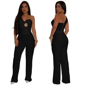 Detail of black one-shoulder jumpsuit with gold metal buckle and back zipper closure