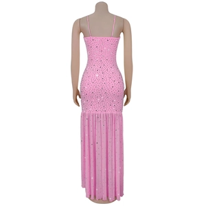 Detail of pink rhinestone dress showing slim-fit fisheye cut and pleated tiered hemline