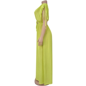 Detail view of lime green sleeveless jumpsuit with waist drawstring and pleated shoulder