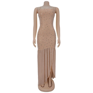 Detail of sequined fish-tail hem with asymmetrical ruffles on a nude pink dress