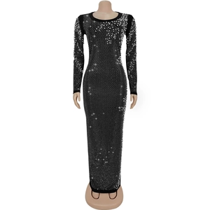 Close-up of elegant black dress featuring intricate rhinestone and pearl embellishments