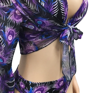 Detail view of purple peacock print bikini with sheer mesh tie-up long sleeve cover-up set